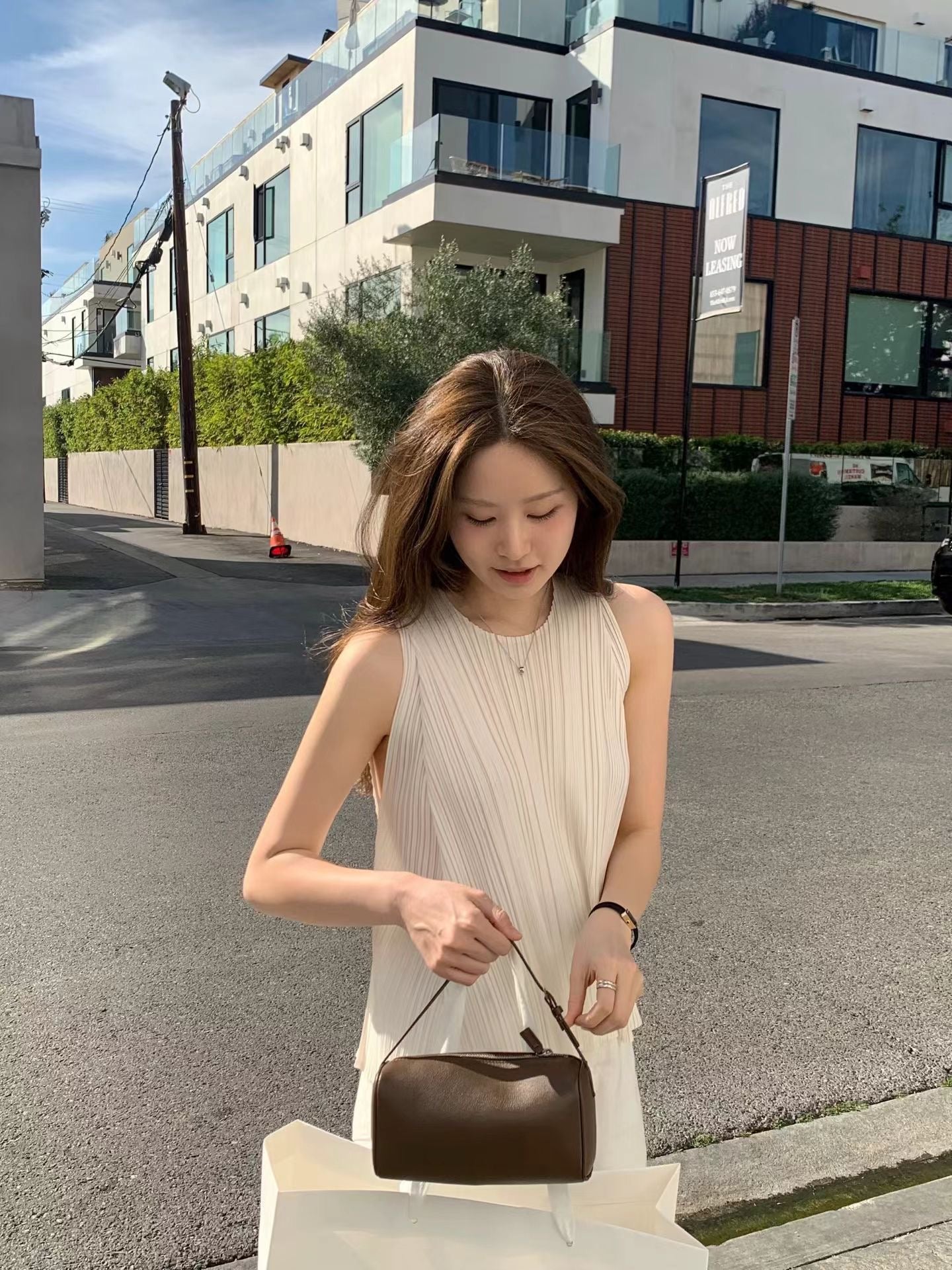 Soft Sheen Pleated Peplum Blouse