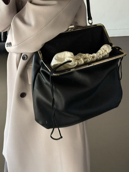 The Lady Clamp Cow Leather Bag
